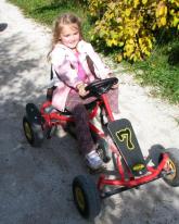 girl-on-pedal-car-1 girl-on-pedal-car-1