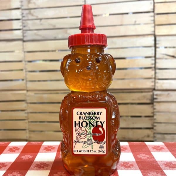 Cranberry Blossom Honey in a honey bear jar sold at Apple Holler